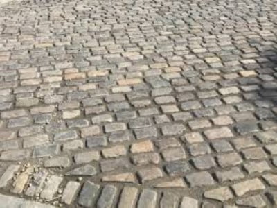 Leicester Paving and Patio Contractors Laying Cobblestones in Leicester